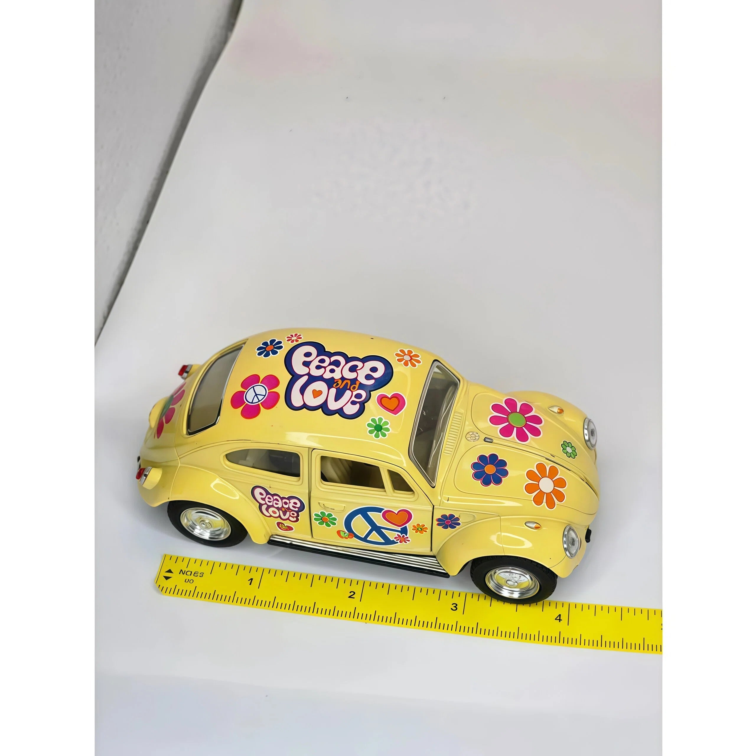 Yellow and Multicolor "Peace and Love" Volkswagen Beetle Toy Car Model